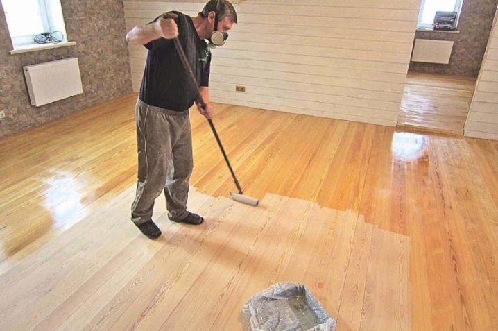 applying varnish to wooden floors