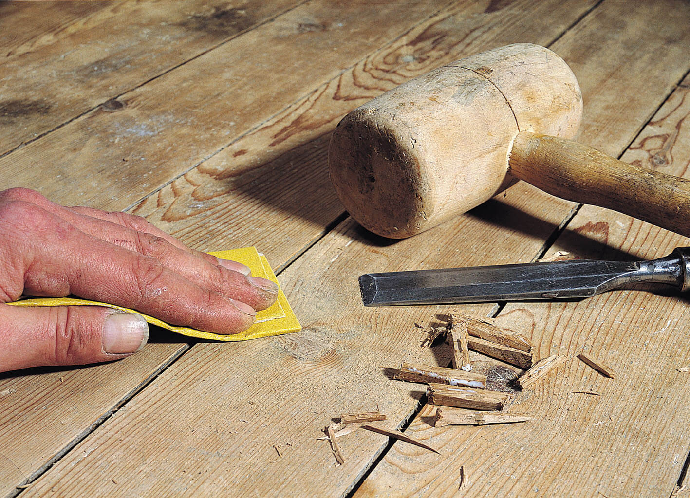 manually sanding floors